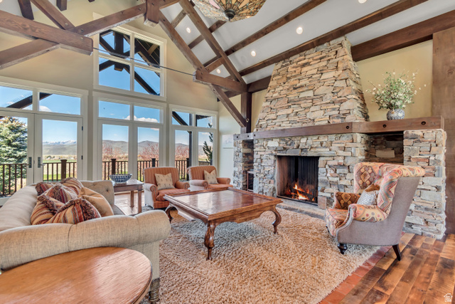 2579 Splendor Valley Road Kamas, UT 84036 - Photo 43 of 87 Living room featuring a mountain view, a fireplace, hardwood / wood-style floors, and lofted ceiling