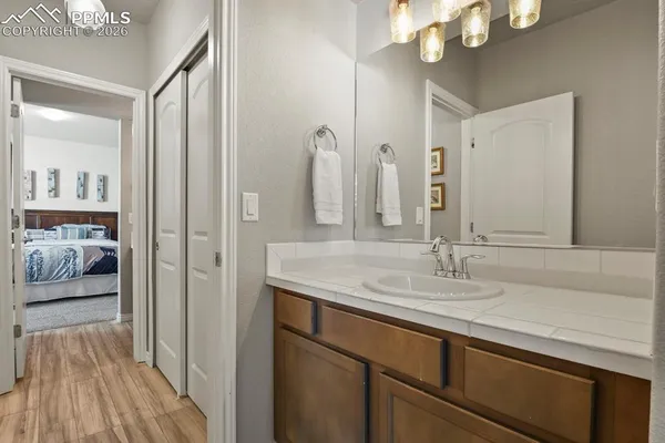 a en suite bathroom with a double vanity sink and a mirror