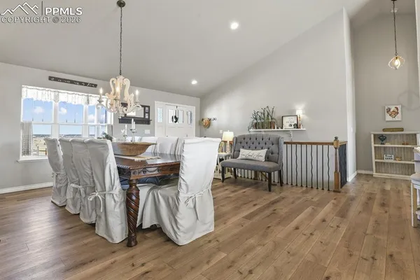 a view of a dining room with furniture window and wooden floor