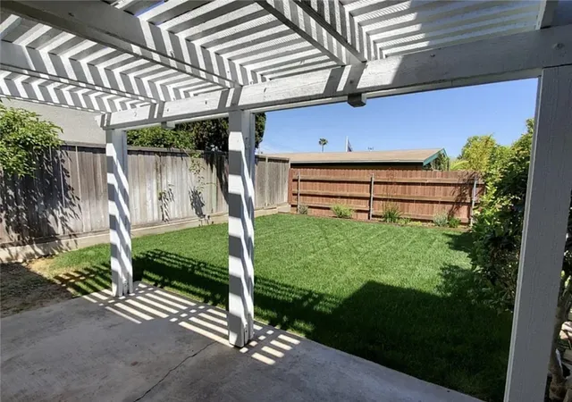 a kitchen with kitchen island granite countertop a stove a sink and a refrigerator