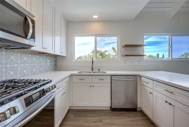 a bathroom with a sink a toilet and bathtub