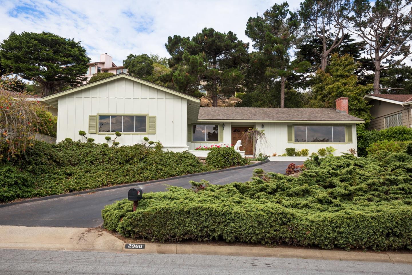 2960 Ribera Road Carmel, CA 93923 - Photo 1 of 19 a front view of a house with a yard