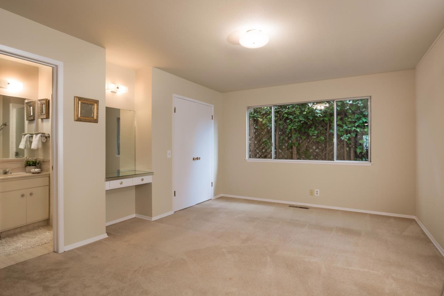 2960 Ribera Road Carmel, CA 93923 - Photo 13 of 19 an empty room with a window and a kitchen