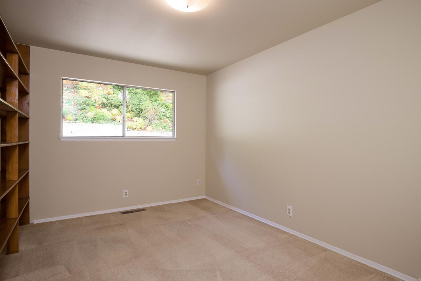 2960 Ribera Road Carmel, CA 93923 - Photo 14 of 19 an empty room with a window