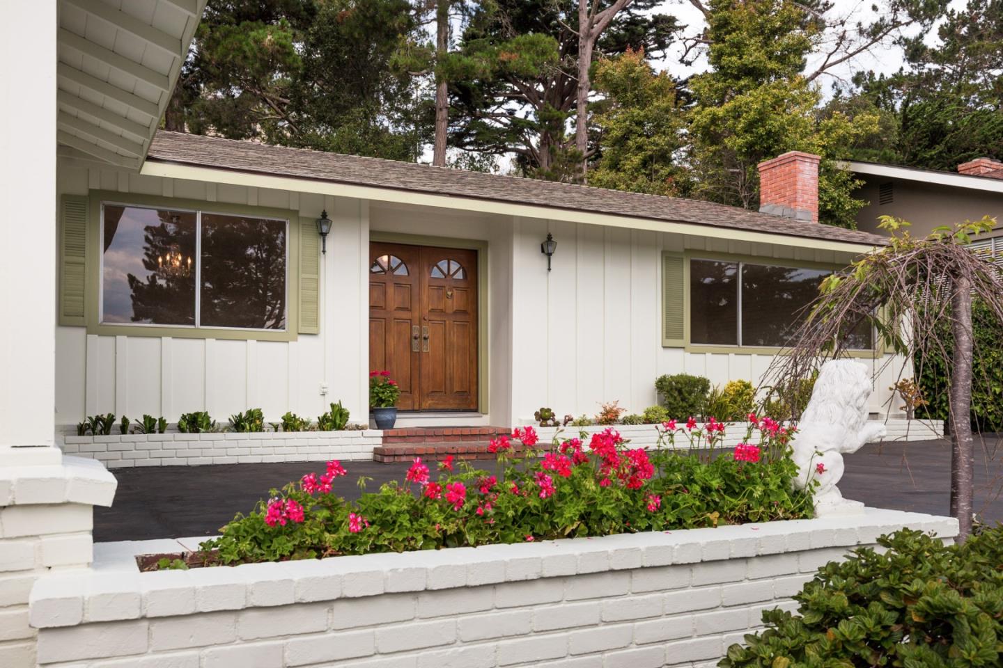 2960 Ribera Road Carmel, CA 93923 - Photo 2 of 19 a front view of a house with a yard