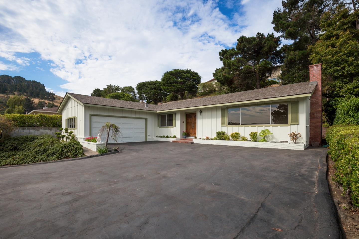 2960 Ribera Road Carmel, CA 93923 - Photo 3 of 19 front view of house with a yard and potted plants