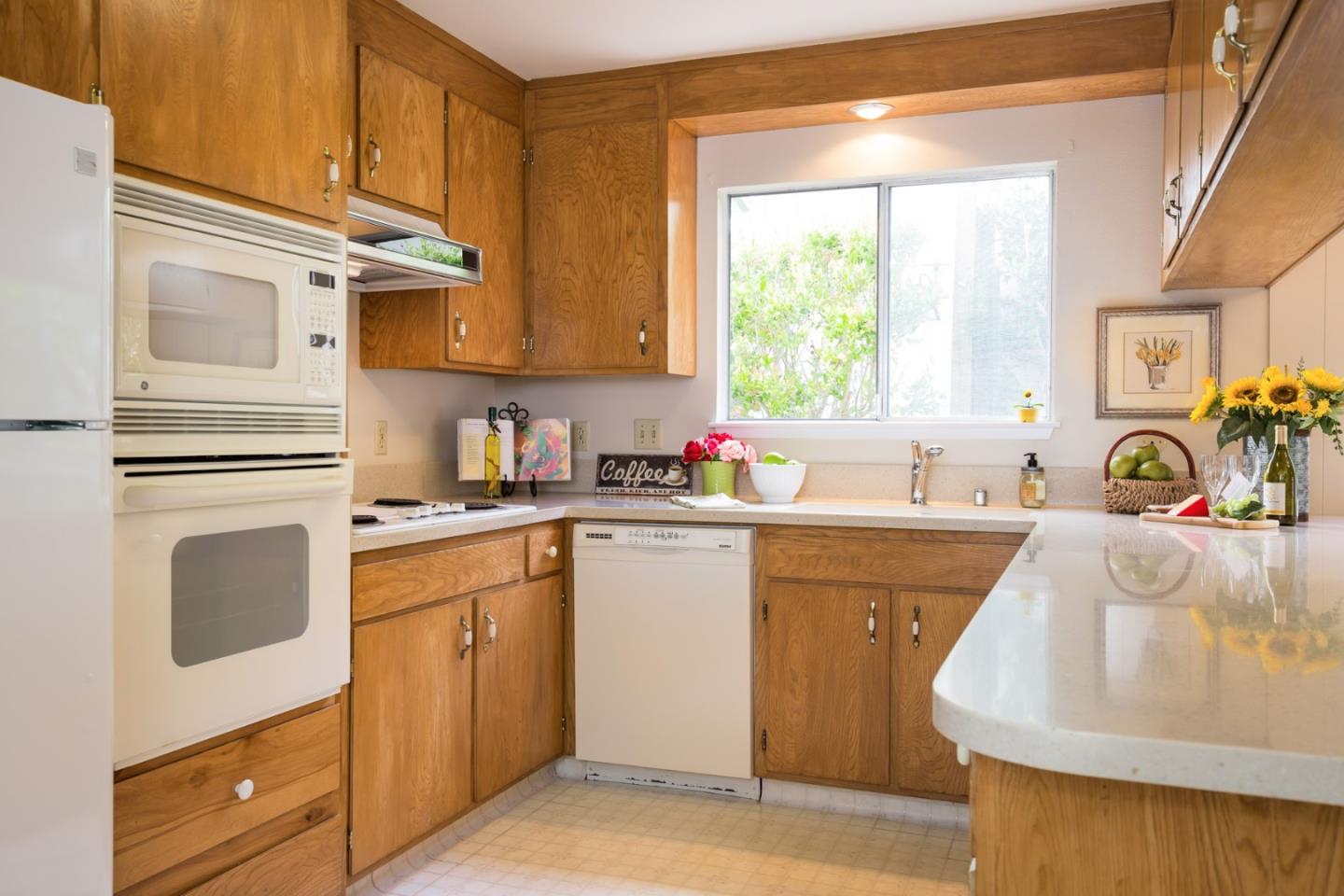 2960 Ribera Road Carmel, CA 93923 - Photo 6 of 19 a kitchen with granite countertop a sink stainless steel appliances and cabinets