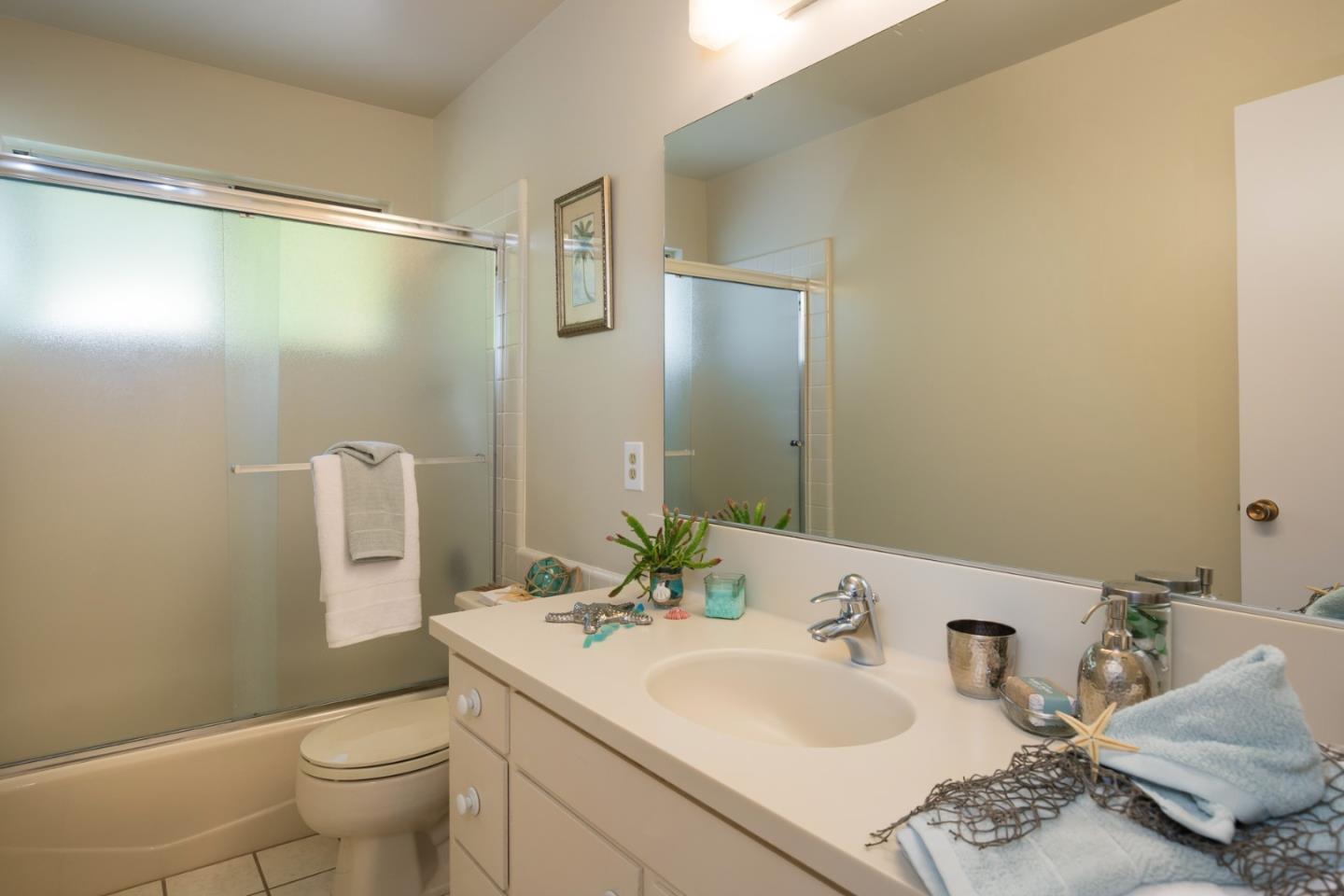 2960 Ribera Road Carmel, CA 93923 - Photo 7 of 19 a bathroom with a sink and a mirror