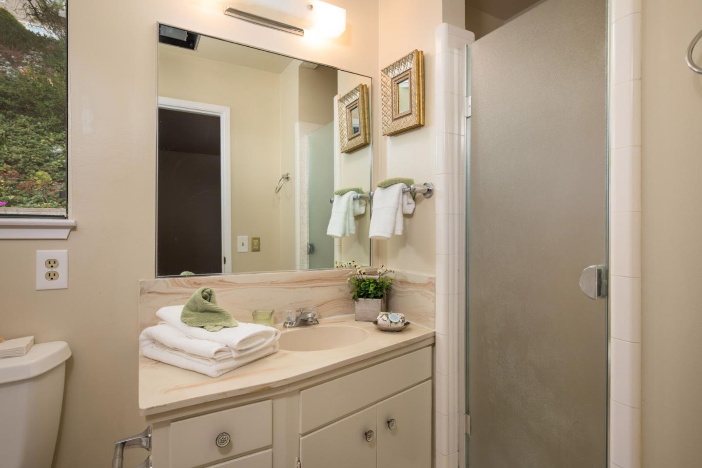 2960 Ribera Road Carmel, CA 93923 - Photo 9 of 19 a bathroom with a sink and a mirror