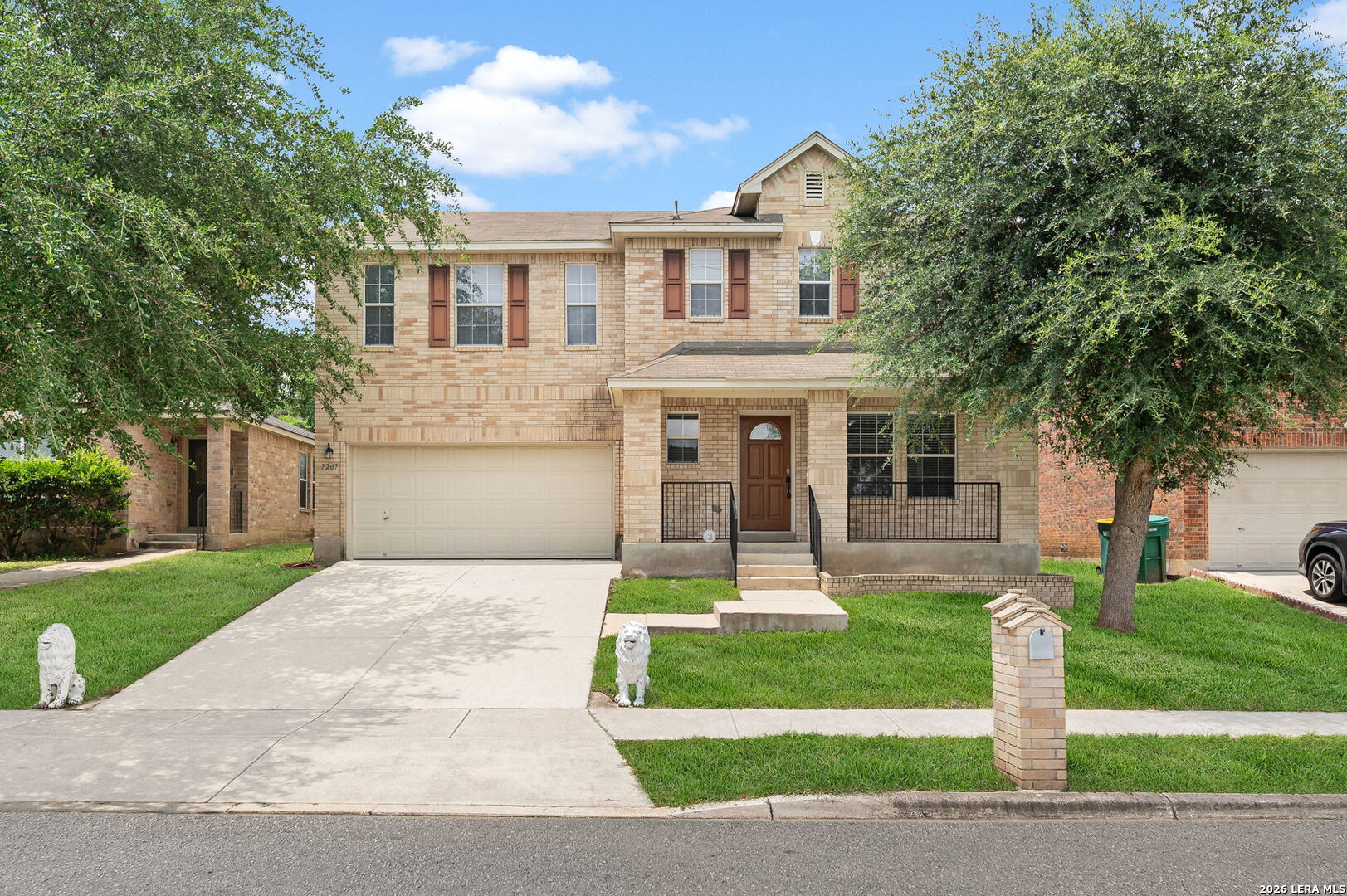 7207 Avery Road Live Oak, TX 78233 - Photo 1 of 32 a front view of a house with a yard and trees
