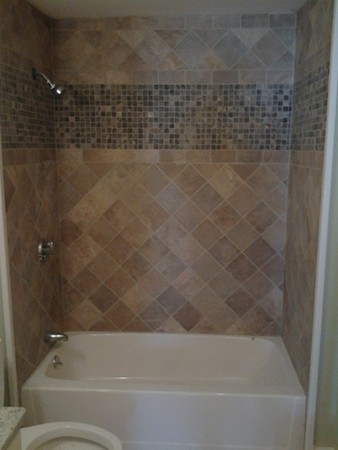 7 St Elmo Road Worcester, MA 01602 - Photo 11 of 17 a bathroom with a bathtub