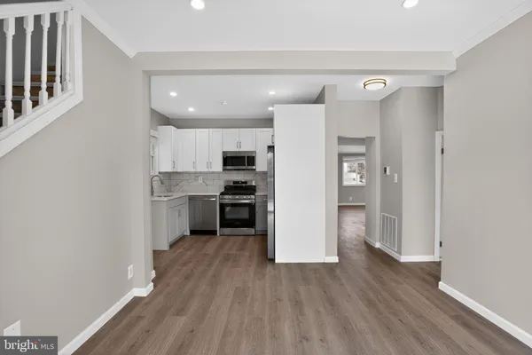 a view of an entryway with wooden floor