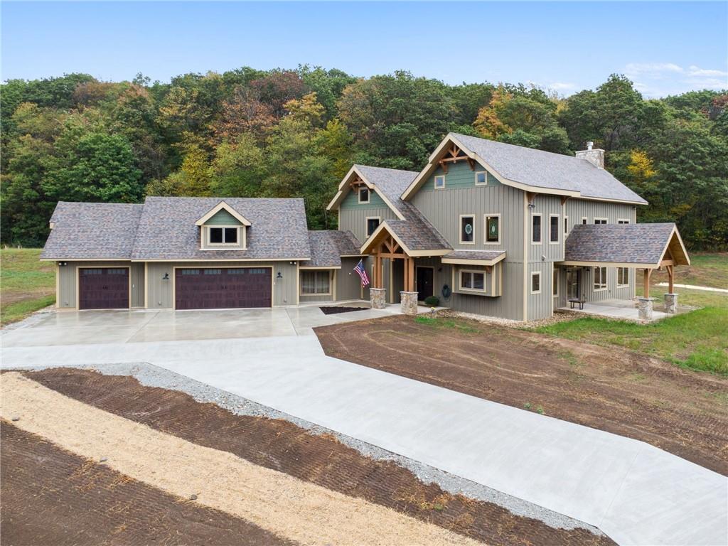 a aerial view of a house next to a road