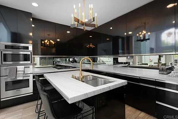 a kitchen with a sink and a refrigerator