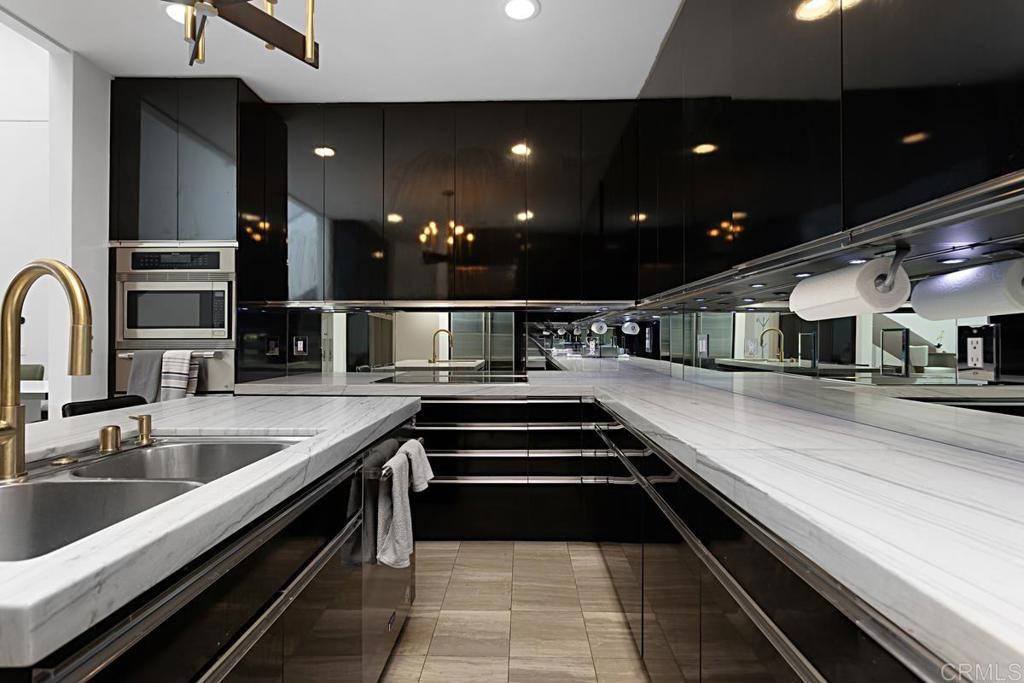 7429 Via De Fortuna Carlsbad, CA 92009 - Photo 15 of 47 a kitchen with stainless steel appliances a sink and a stove