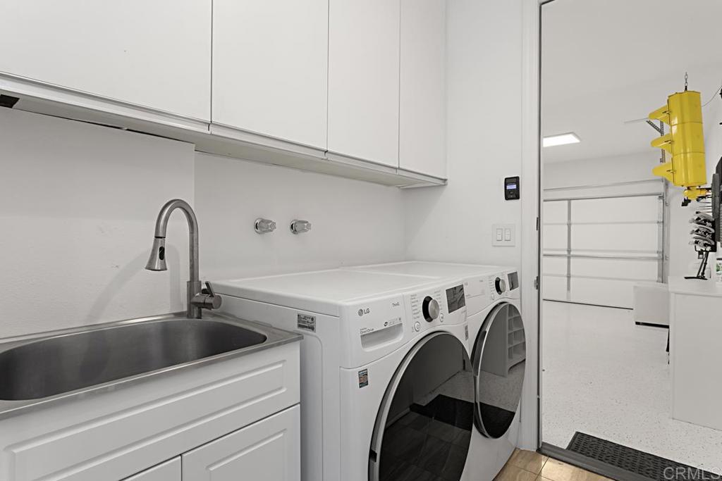 7429 Via De Fortuna Carlsbad, CA 92009 - Photo 17 of 47 a utility room with dryer and washer