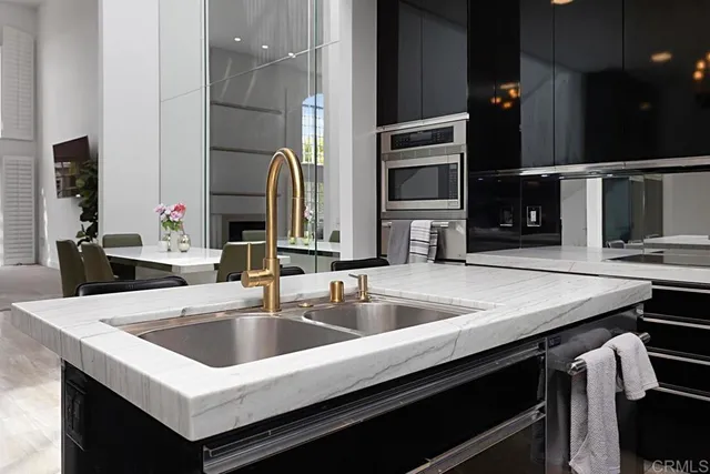 a kitchen with a sink and a refrigerator