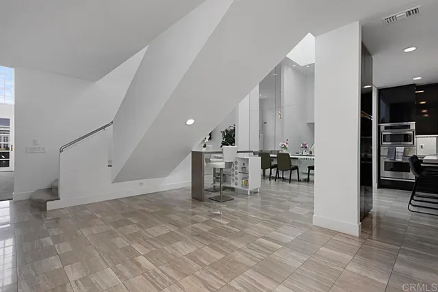 a room with furniture and a flat screen tv