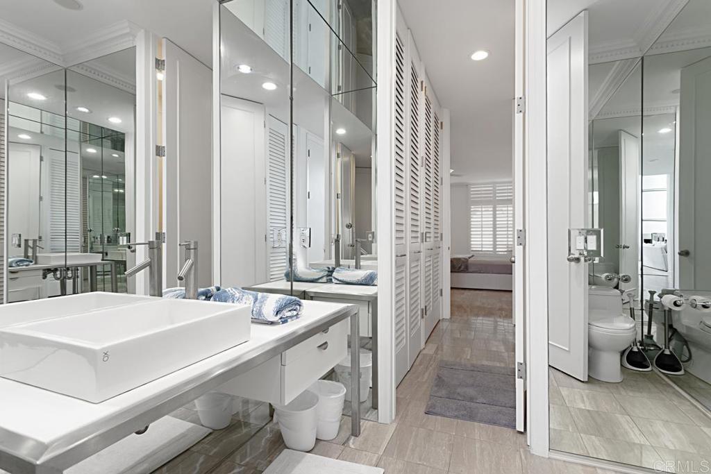 7429 Via De Fortuna Carlsbad, CA 92009 - Photo 22 of 47 a bathroom with a sink and a mirror