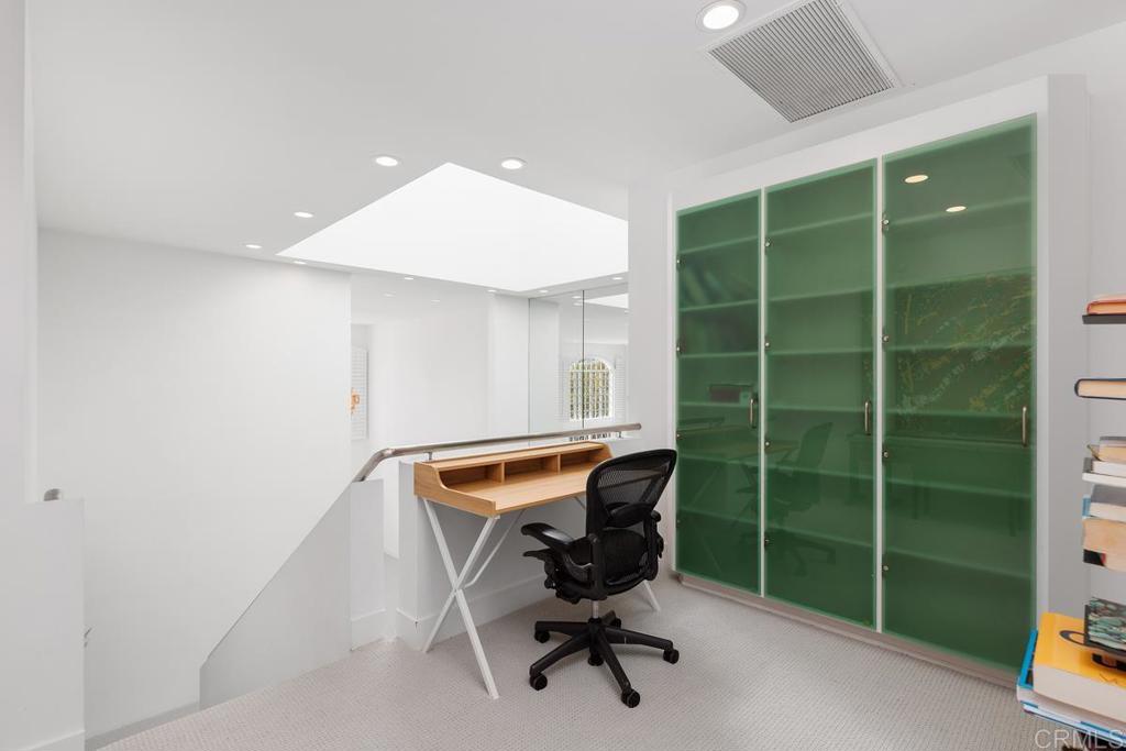 7429 Via De Fortuna Carlsbad, CA 92009 - Photo 23 of 47 a view of a workspace with furniture and a gate