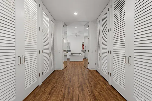 a bathroom with a bathtub a sink and a window