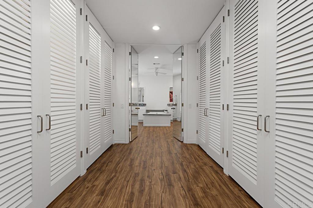 7429 Via De Fortuna Carlsbad, CA 92009 - Photo 27 of 47 a view of a hallway with wooden floor