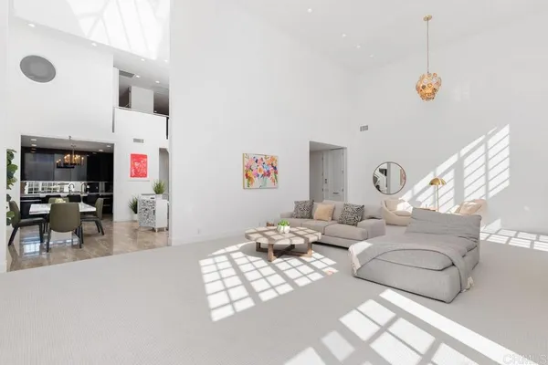 a living room with furniture window and wooden floor