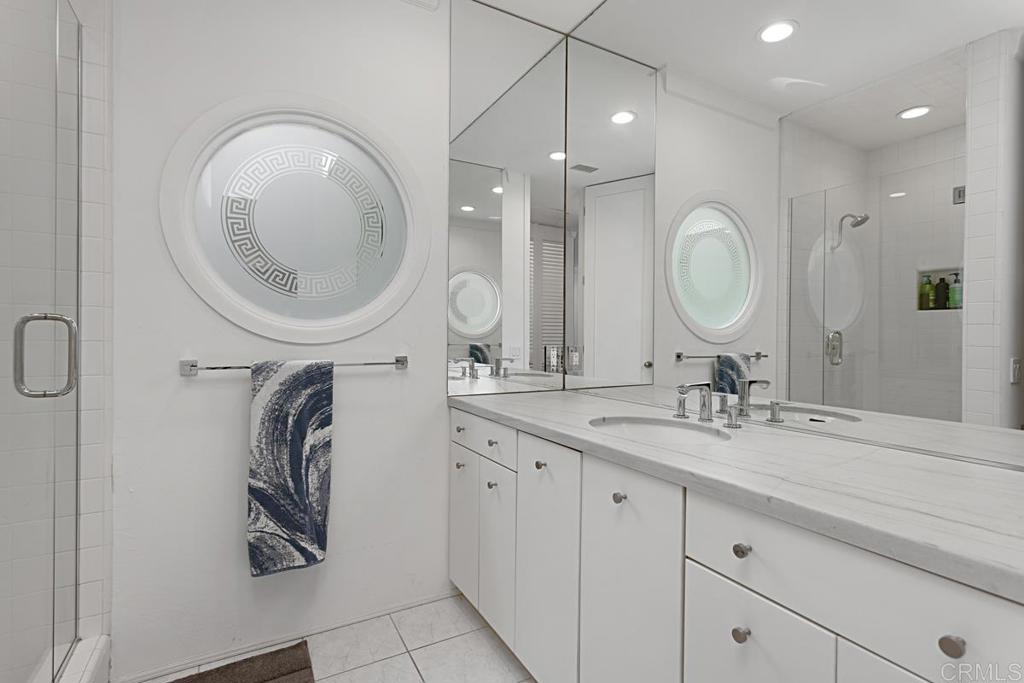 7429 Via De Fortuna Carlsbad, CA 92009 - Photo 33 of 47 a bathroom with a double vanity sink and a mirror