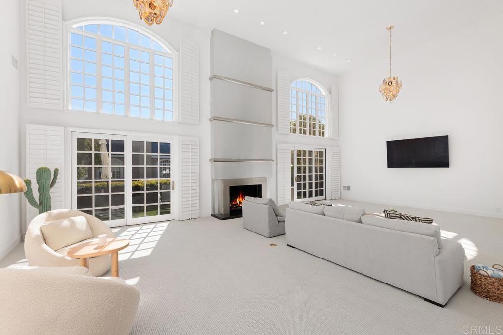 7429 Via De Fortuna Carlsbad, CA 92009 - Photo 4 of 47 a living room with furniture fireplace and flat screen tv