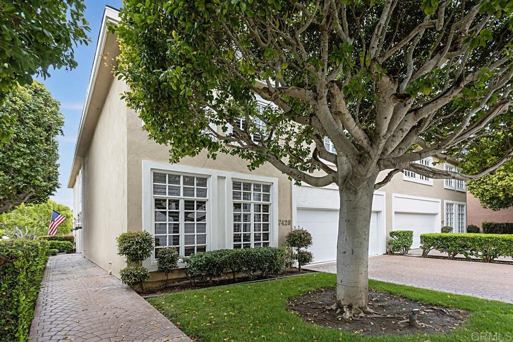 7429 Via De Fortuna Carlsbad, CA 92009 - Photo 46 of 47 a front view of a house with garden and trees