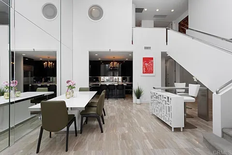 a large kitchen with a table and chairs