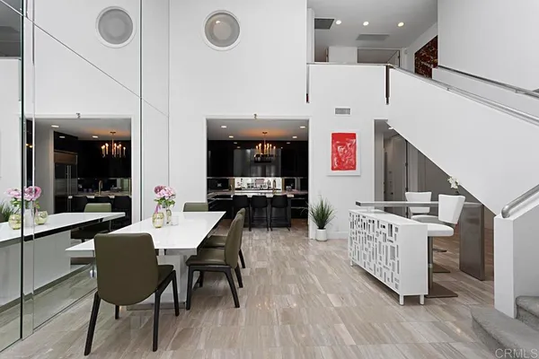 a large kitchen with a table and chairs