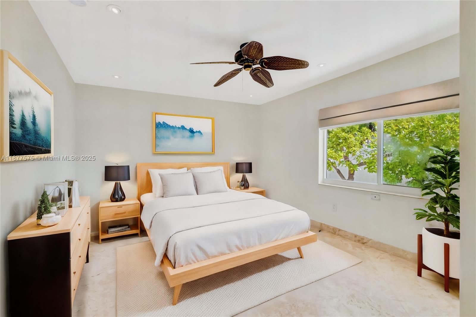 200 Harbor Drive Key Biscayne, FL 33149 - Photo 9 of 16 a bedroom with a large bed and a window