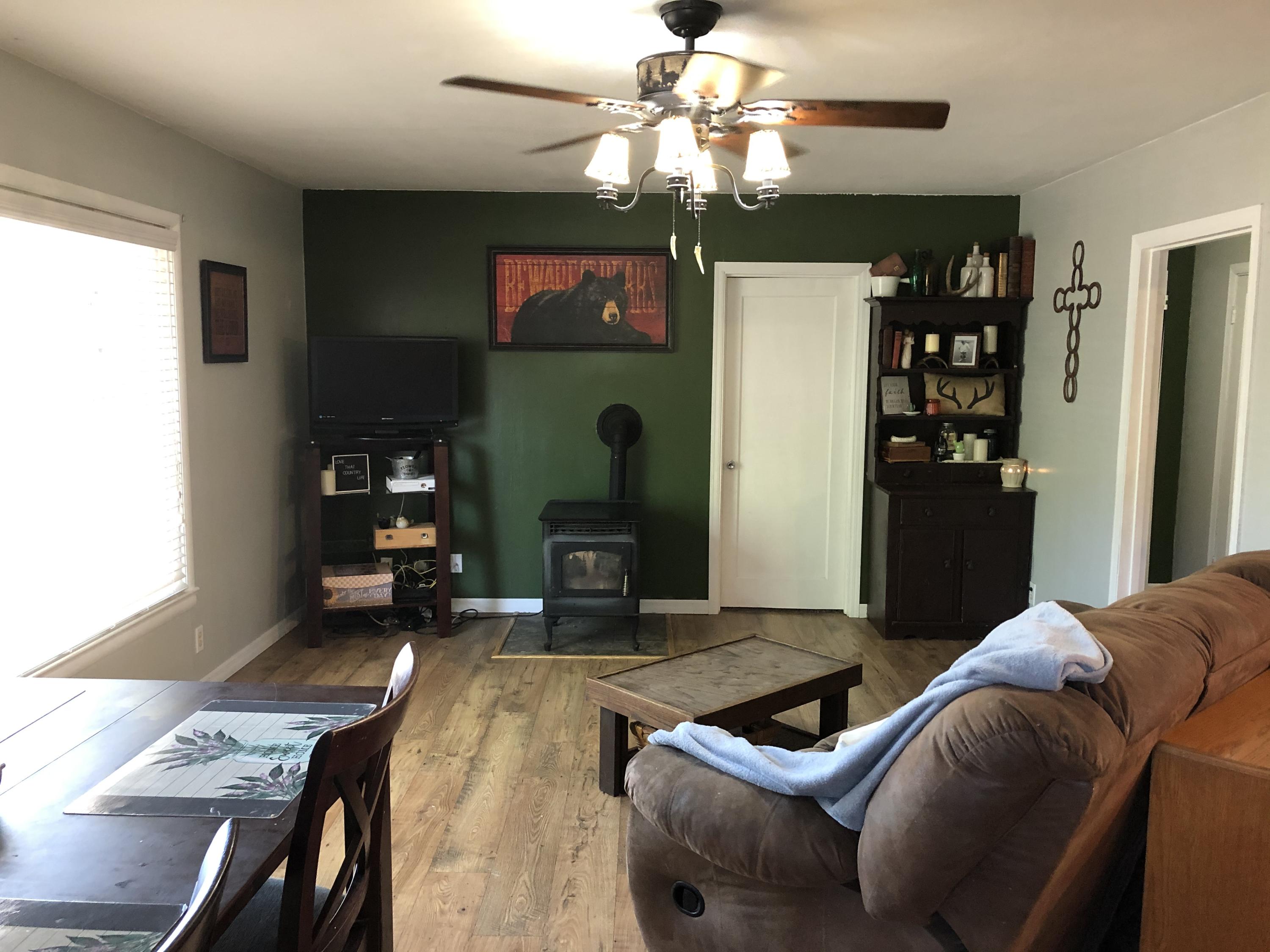 441 Upper Applegate Road Jacksonville, OR 97530 - Photo 24 of 25 a living room with furniture and a chandelier
