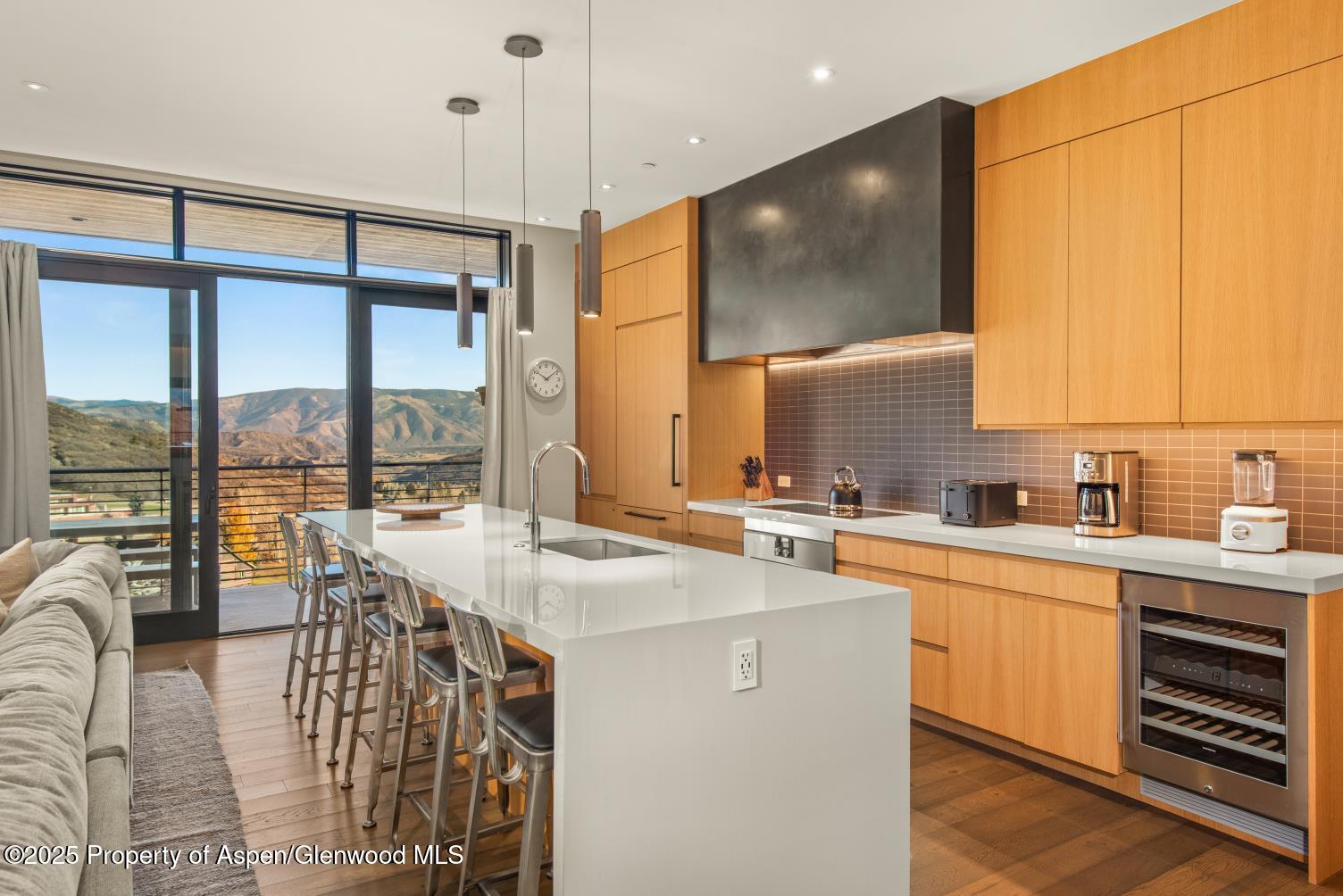 77 Wood Road, Unit 603 Snowmass Village, CO 81615 - Photo 13 of 45 a kitchen with stainless steel appliances a sink and cabinets