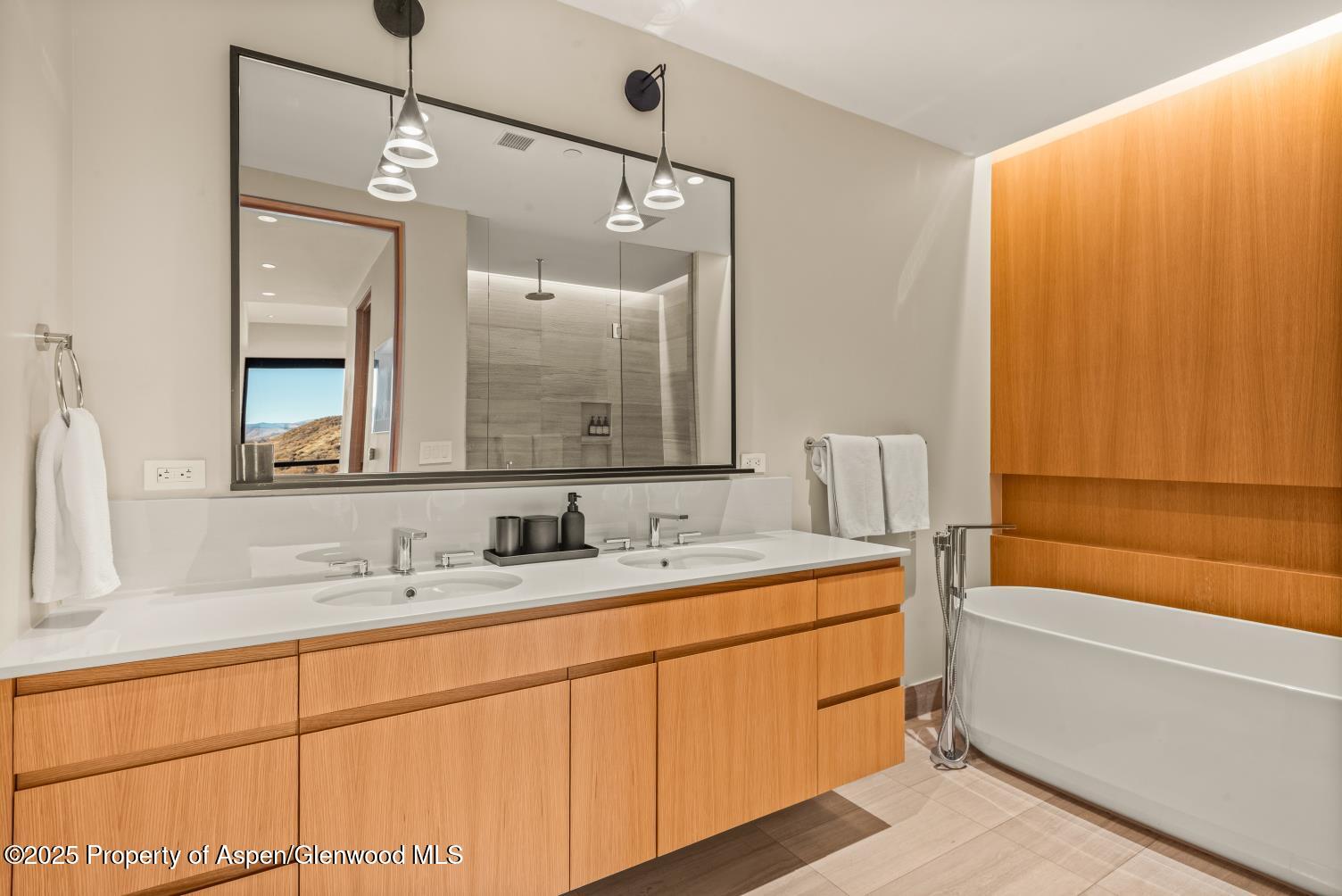77 Wood Road, Unit 603 Snowmass Village, CO 81615 - Photo 21 of 45 a bathroom with a sink and a mirror