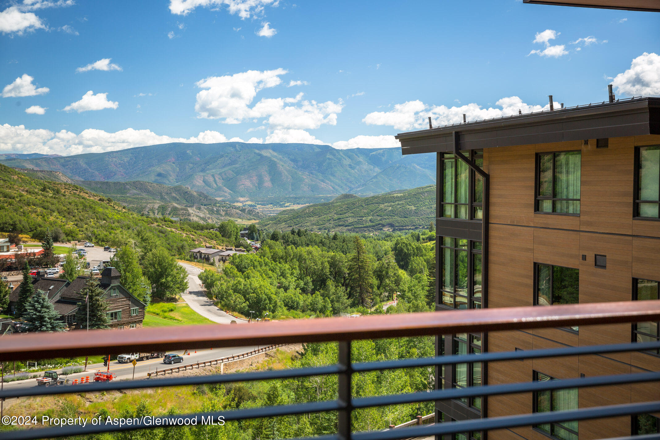 77 Wood Road, Unit 603 Snowmass Village, CO 81615 - Photo 25 of 45 a view of a balcony with an ocean view