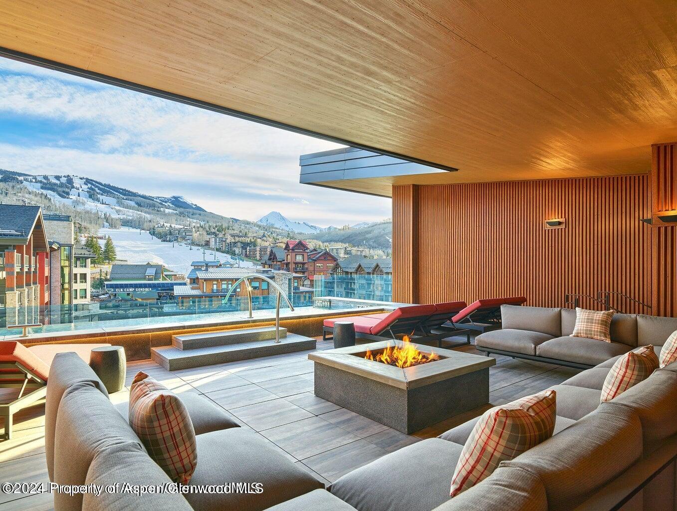 77 Wood Road, Unit 603 Snowmass Village, CO 81615 - Photo 29 of 45 a living room with furniture city view