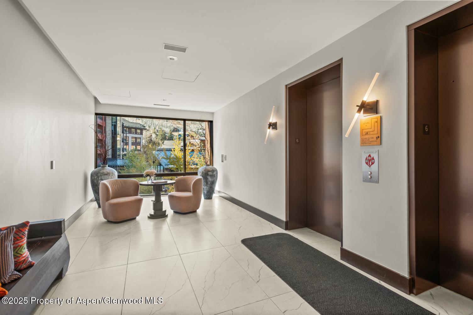 77 Wood Road, Unit 603 Snowmass Village, CO 81615 - Photo 31 of 45 a living room with furniture and a potted plant