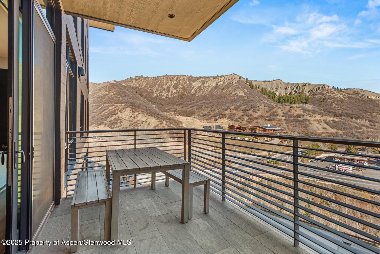 77 Wood Road, Unit 603 Snowmass Village, CO 81615 - Photo 33 of 45 a view of a balcony with furniture and city view