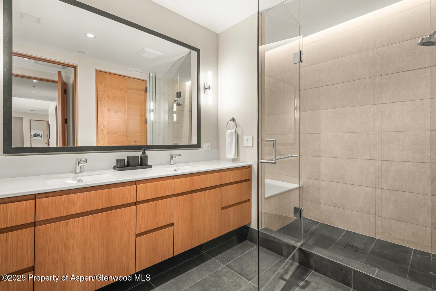 77 Wood Road, Unit 603 Snowmass Village, CO 81615 - Photo 37 of 45 a bathroom with a double vanity sink and a mirror