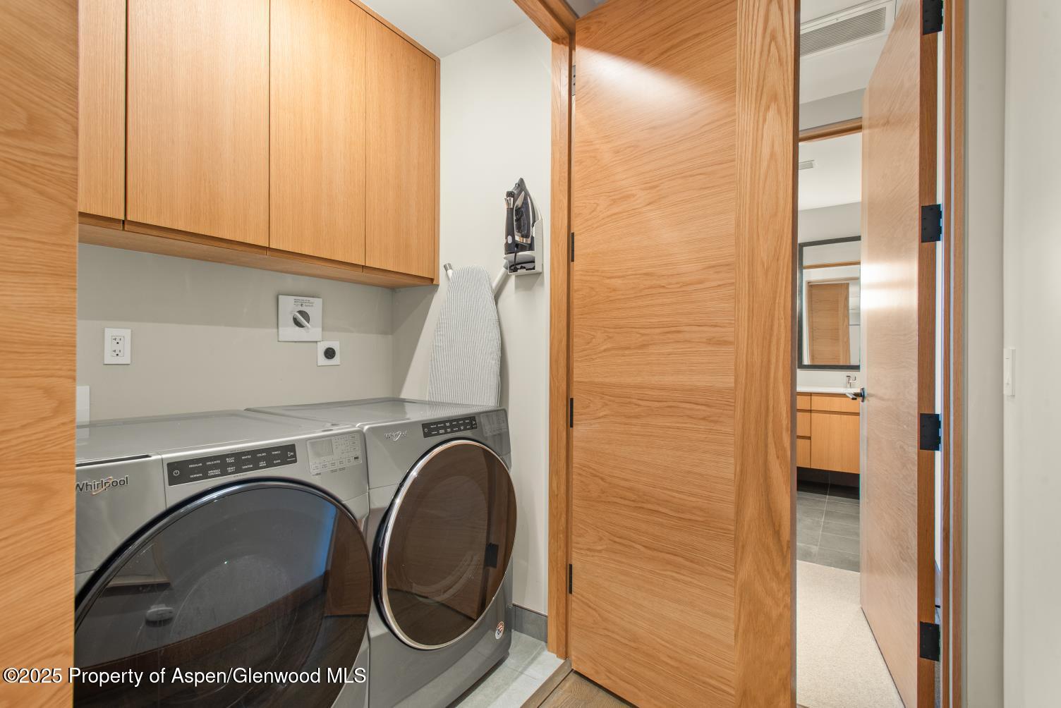 77 Wood Road, Unit 603 Snowmass Village, CO 81615 - Photo 41 of 45 a utility room with dryer and washer