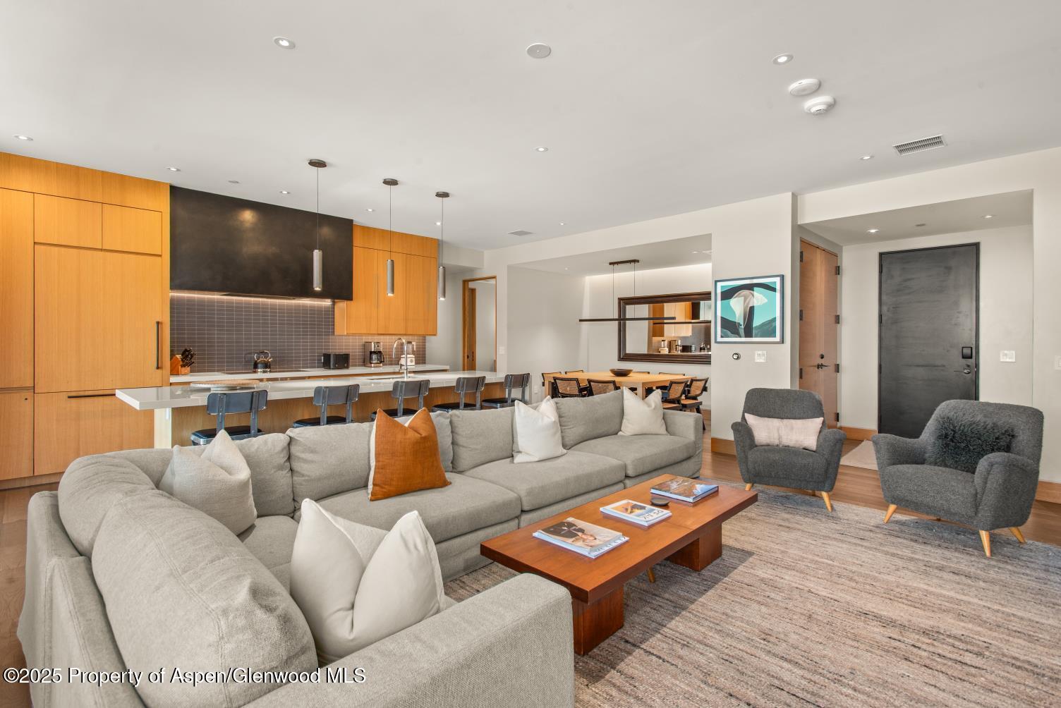 77 Wood Road, Unit 603 Snowmass Village, CO 81615 - Photo 8 of 45 a living room with furniture and a flat screen tv