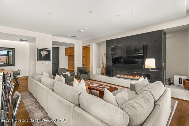 a large kitchen with kitchen island a large window