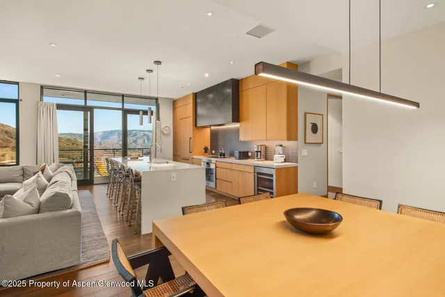 a kitchen with stainless steel appliances a sink and cabinets