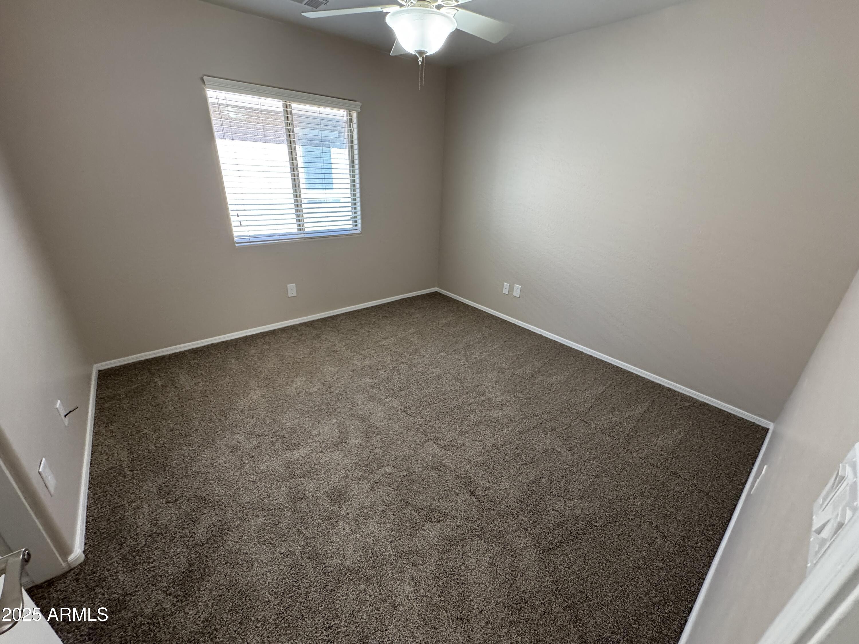 3822 East Santa Fe Lane Gilbert, AZ 85297 - Photo 13 of 24 an empty room with a window