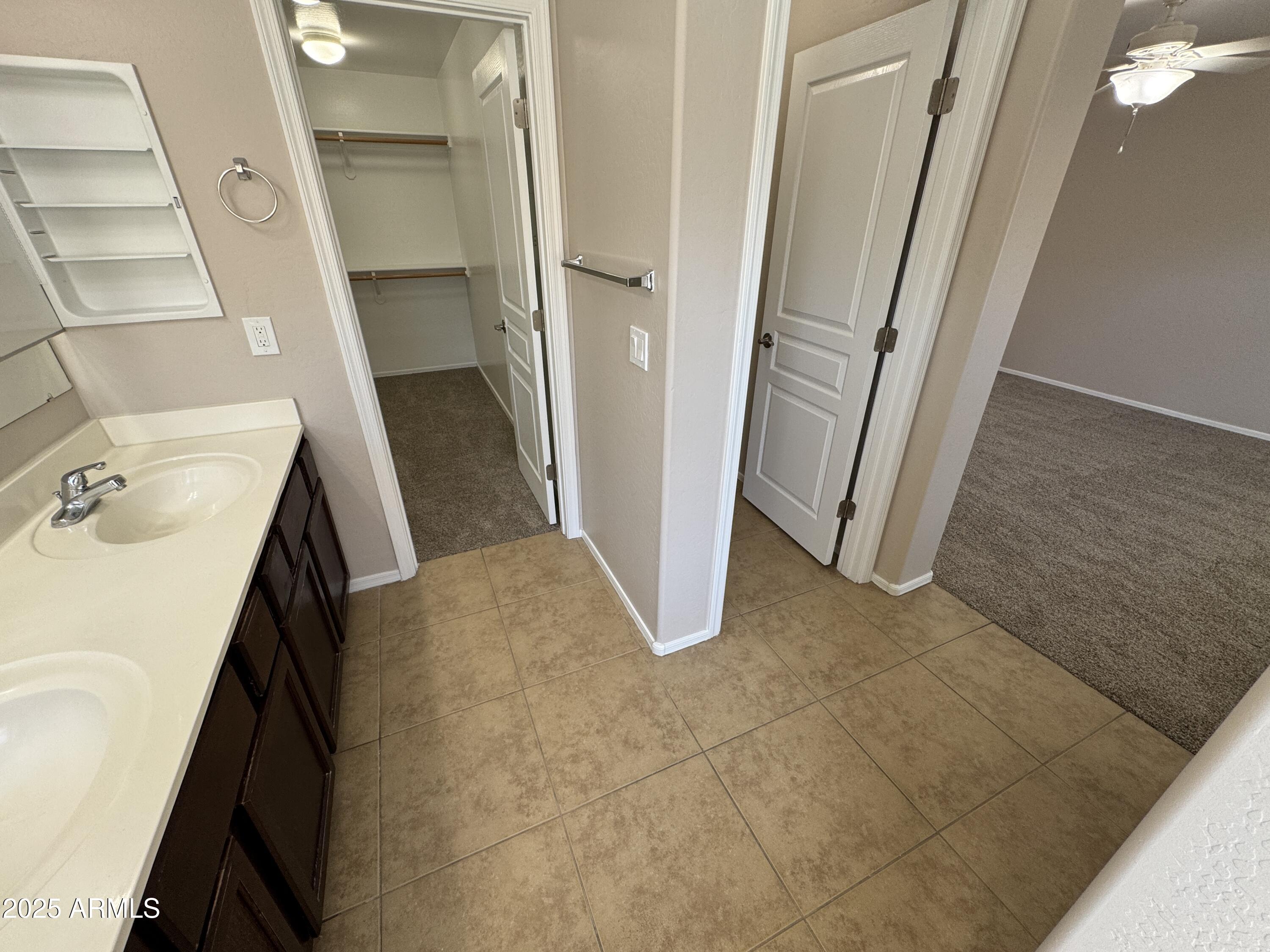 3822 East Santa Fe Lane Gilbert, AZ 85297 - Photo 18 of 24 a view of a kitchen from a hallway