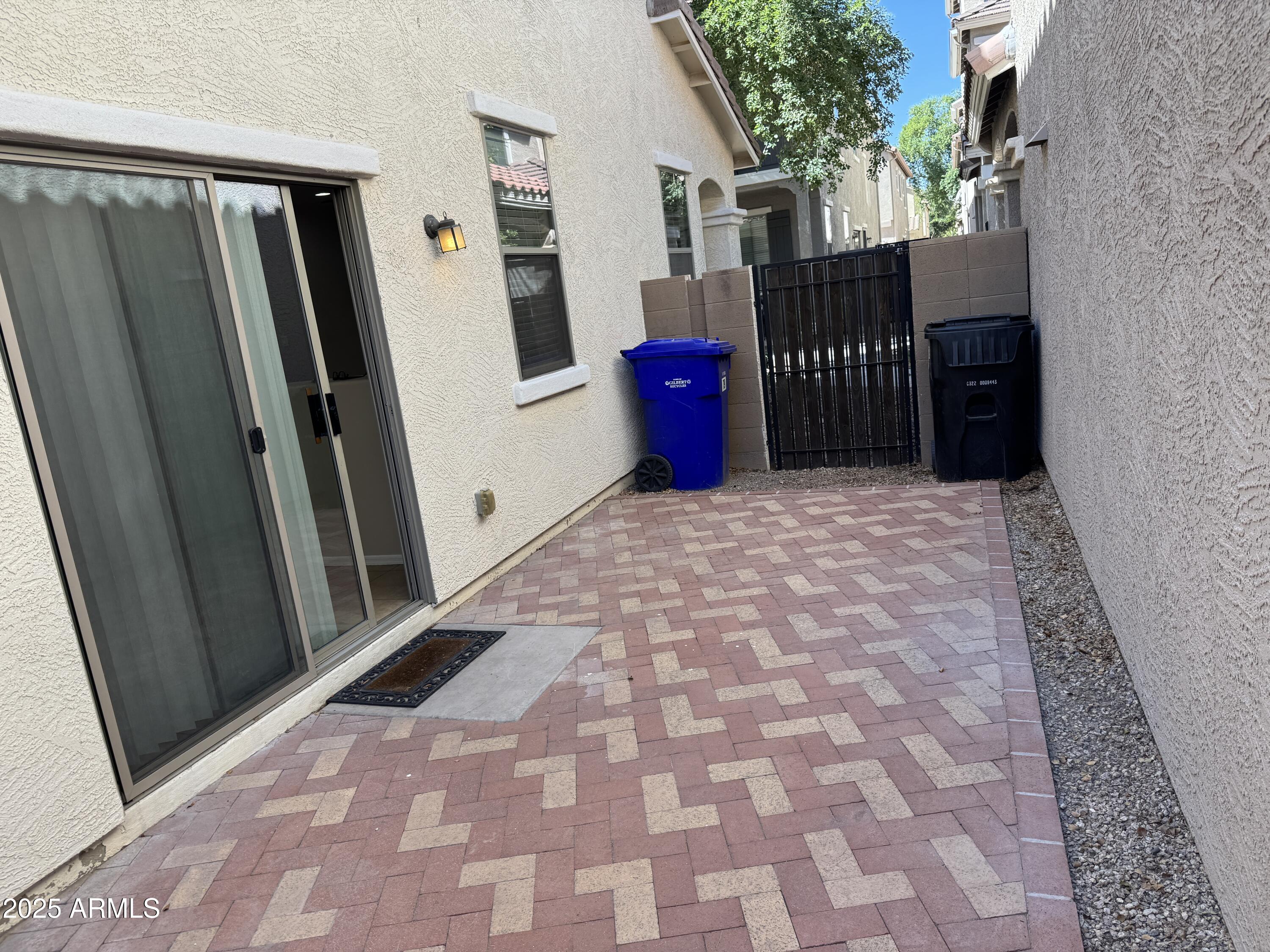 3822 East Santa Fe Lane Gilbert, AZ 85297 - Photo 21 of 24 a view of a door with wooden fence
