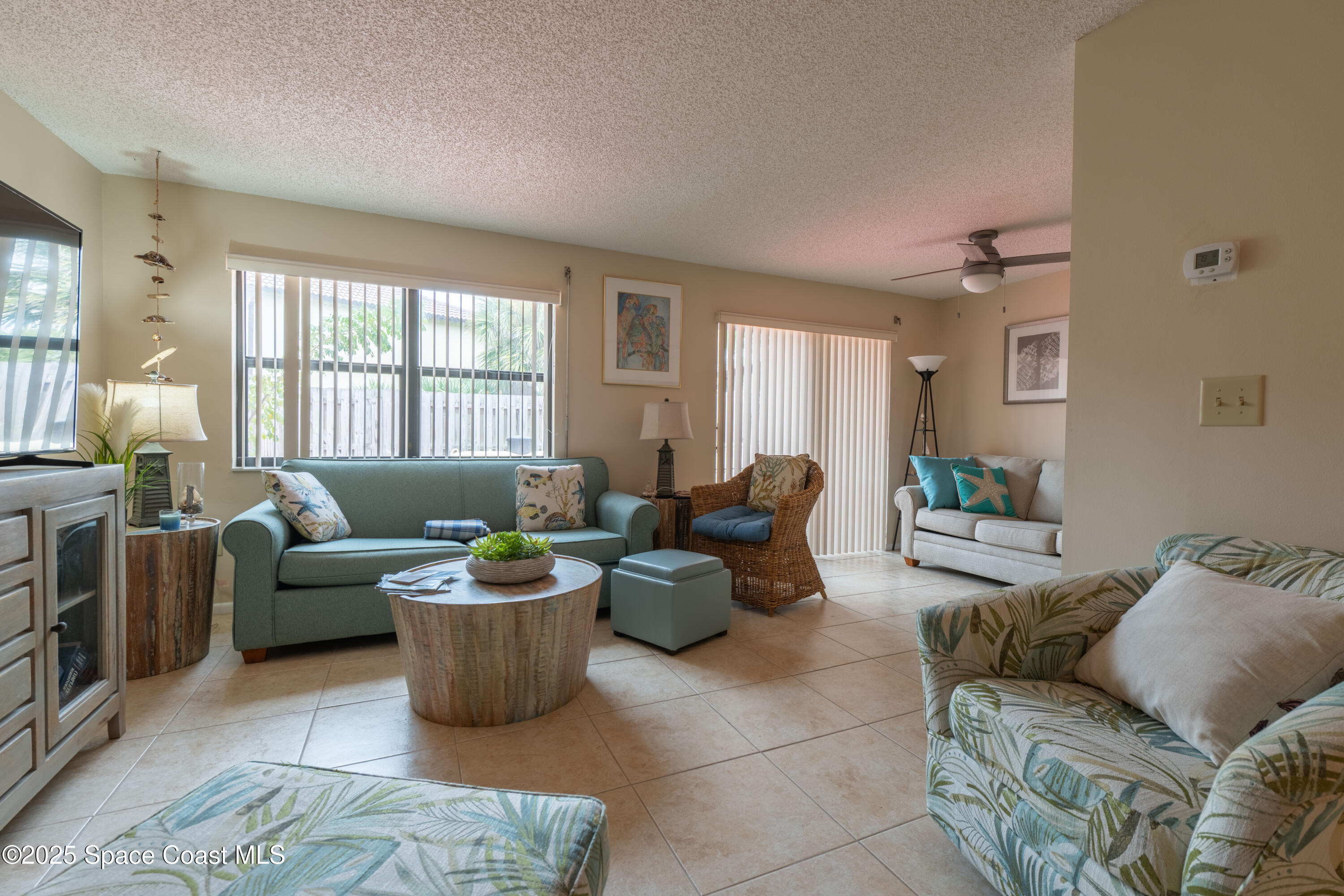 3222 Beach View Way Melbourne Beach, FL 32951 - Photo 12 of 31 a living room with furniture and a window