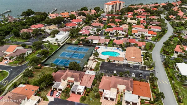 an aerial view of residential houses with outdoor space